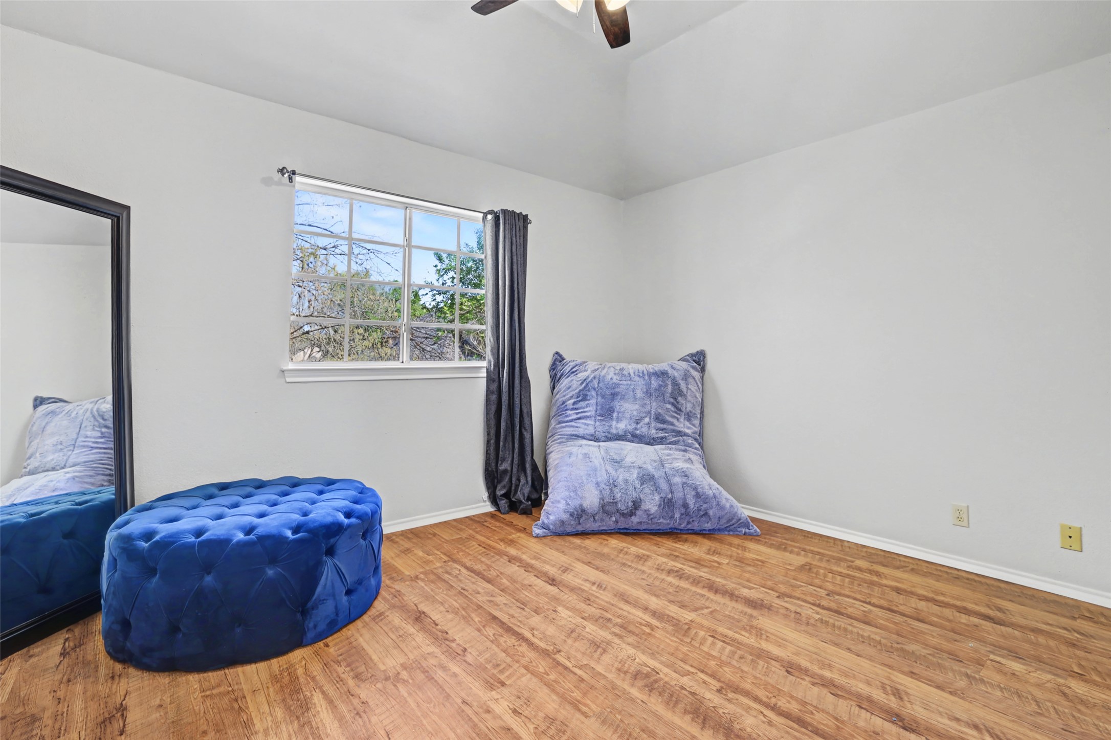 1109 Pebble Brook Road Cedar Park, TX 78613 - Photo 26 of 40 Living area with wood finished floors, a ceiling fan, and vaulted ceiling