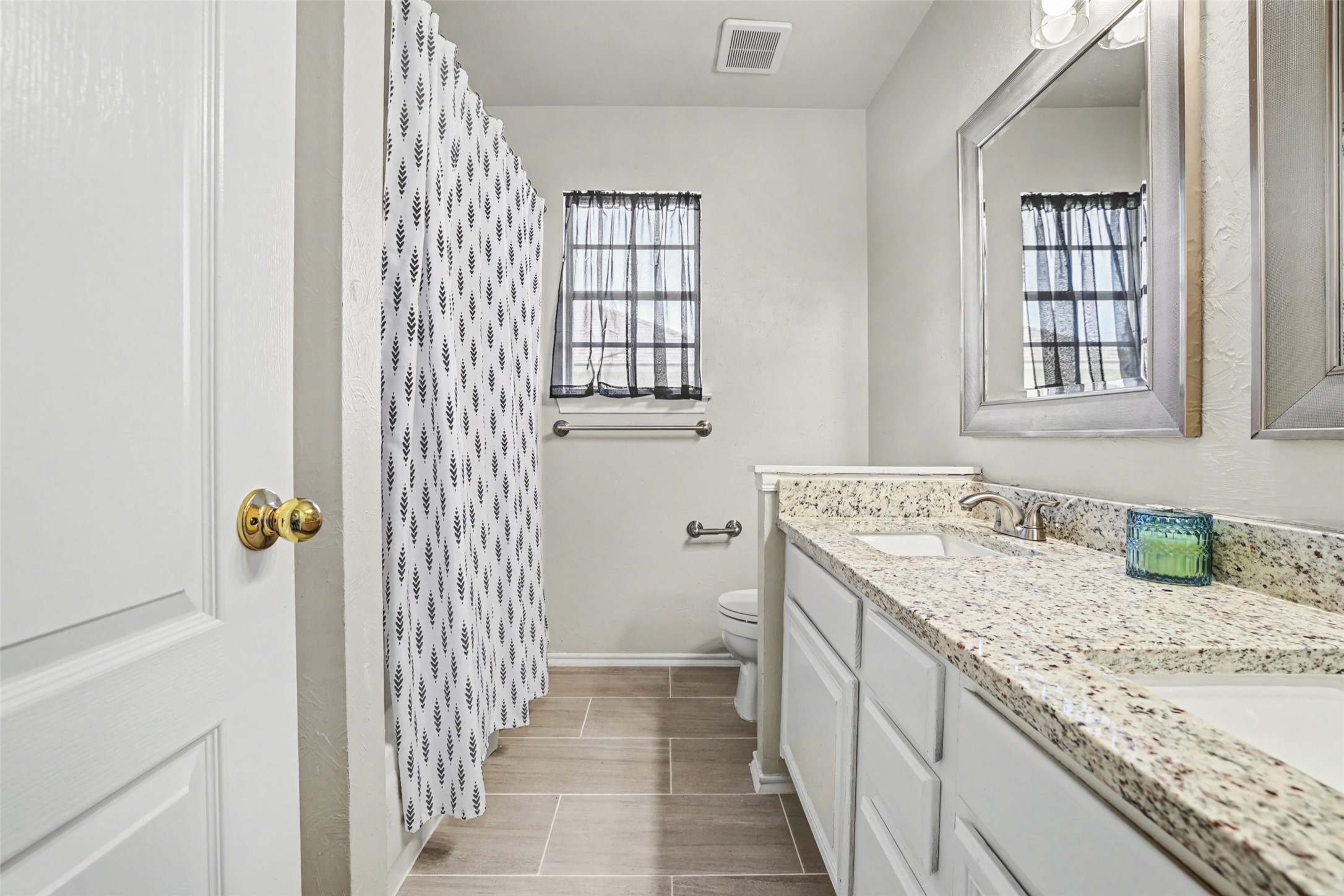 1109 Pebble Brook Road Cedar Park, TX 78613 - Photo 28 of 40 Full bathroom featuring double vanity and a shower with shower curtain