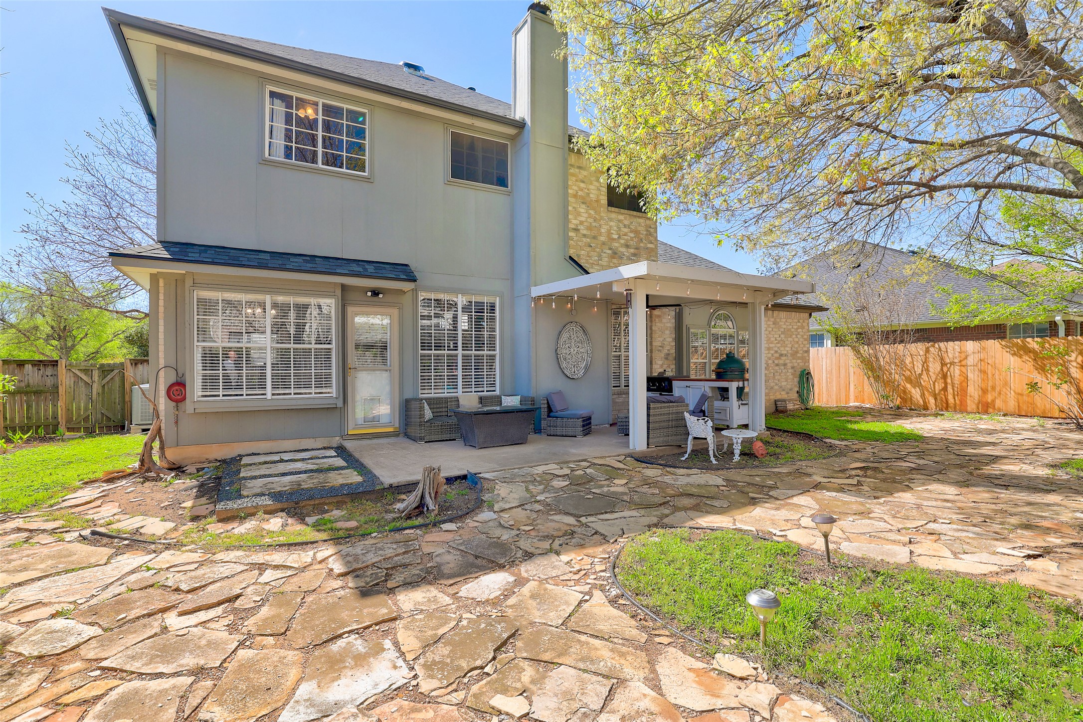 1109 Pebble Brook Road Cedar Park, TX 78613 - Photo 40 of 40 Rear view of house featuring a chimney, a patio area, and a fenced backyard