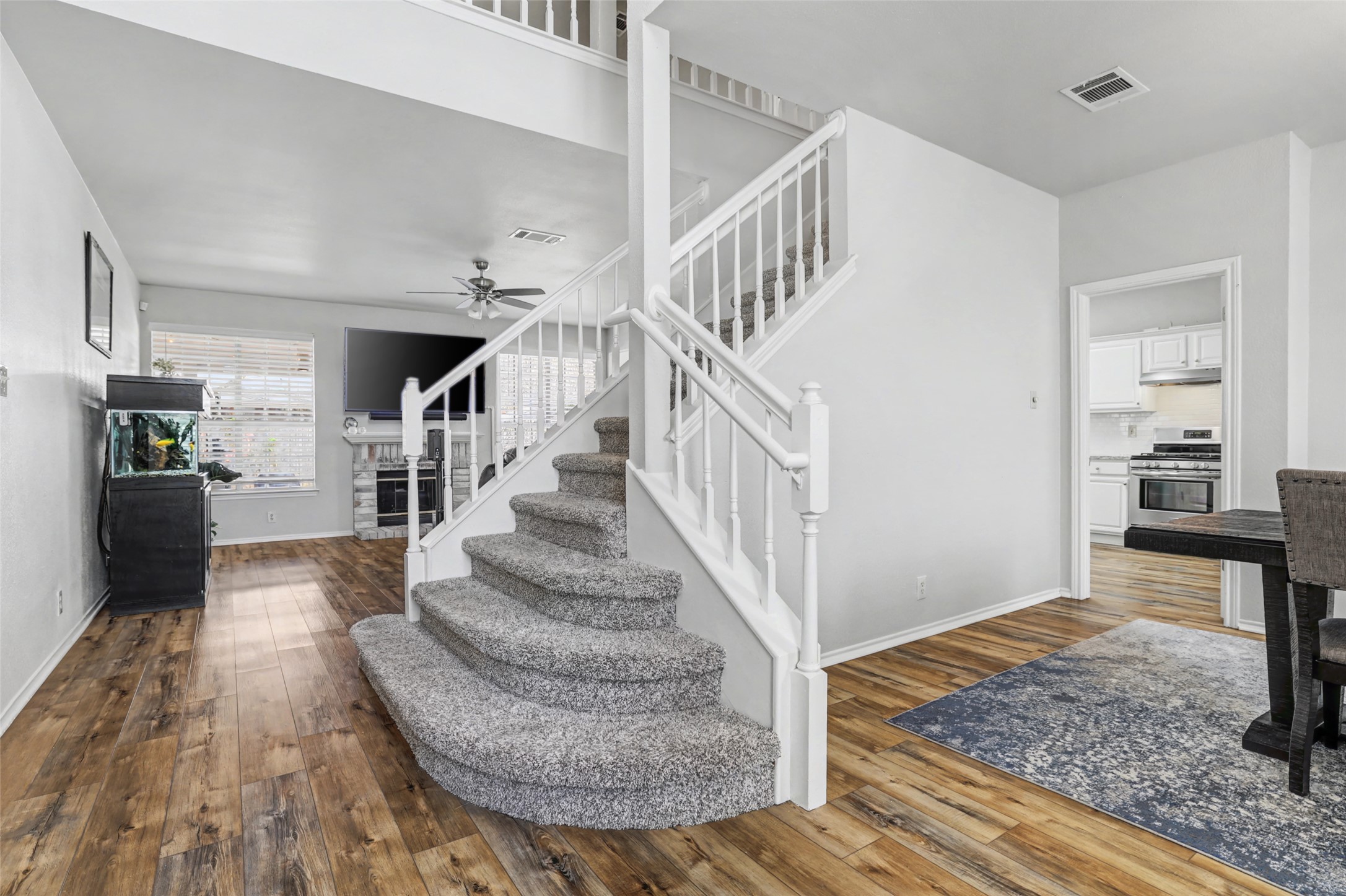 1109 Pebble Brook Road Cedar Park, TX 78613 - Photo 5 of 40 Staircase featuring hardwood / wood-style flooring and a ceiling fan