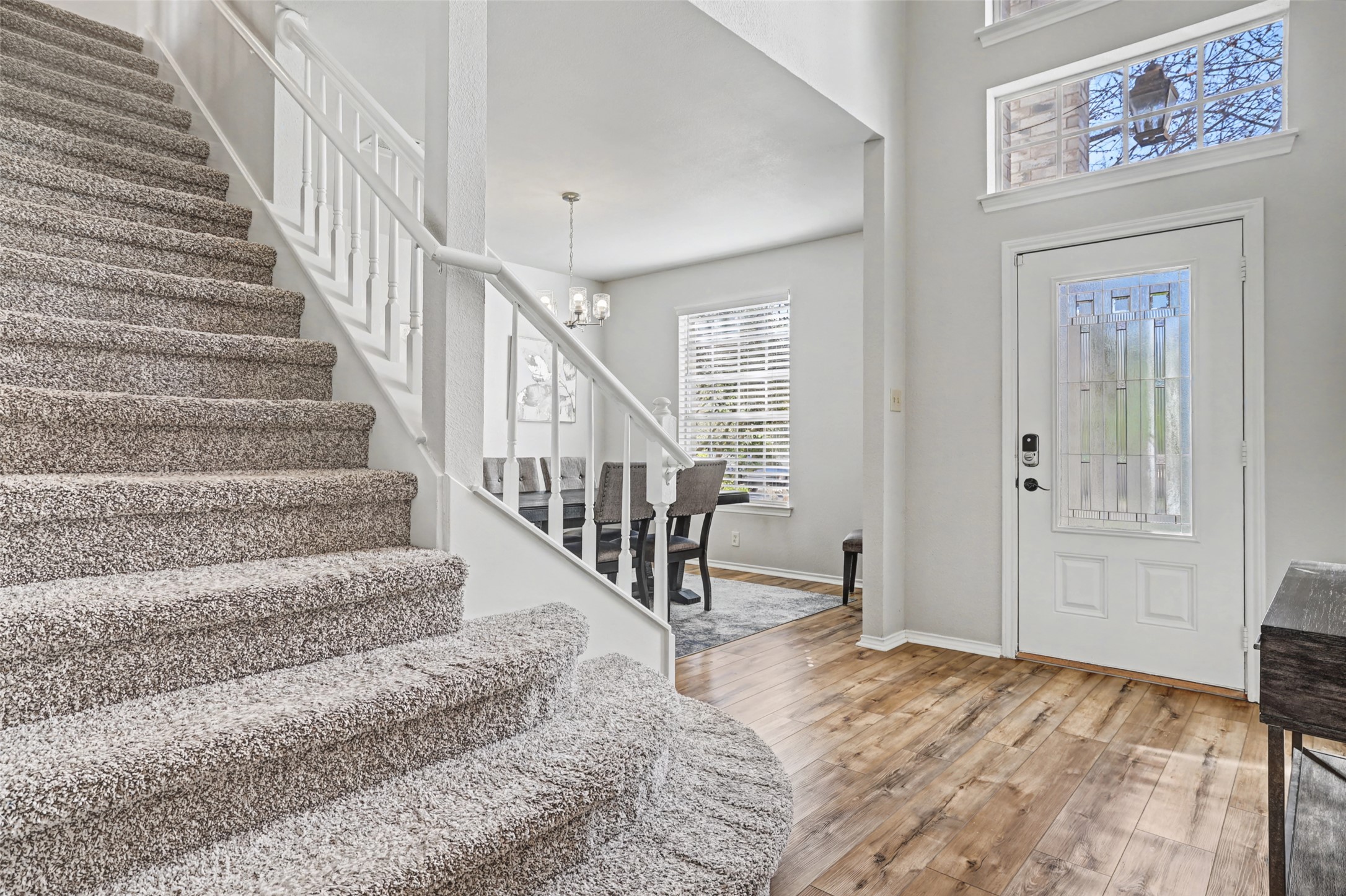 1109 Pebble Brook Road Cedar Park, TX 78613 - Photo 6 of 40 Foyer entrance featuring light wood-type flooring and a chandelier