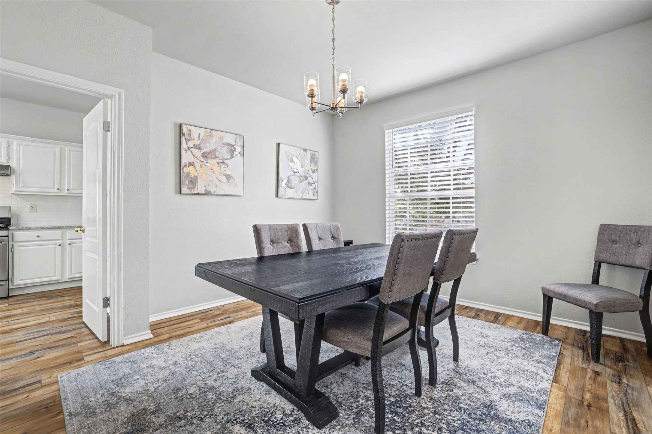 1109 Pebble Brook Road Cedar Park, TX 78613 - Photo 7 of 40 Dining area with hanging lights and light wood-type flooring