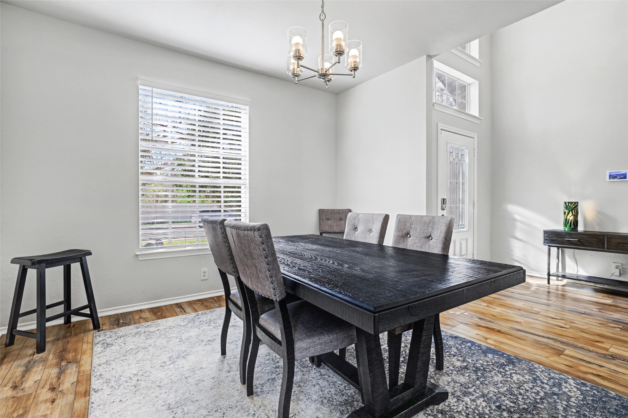 1109 Pebble Brook Road Cedar Park, TX 78613 - Photo 8 of 40 Dining space featuring a chandelier and wood finished floors