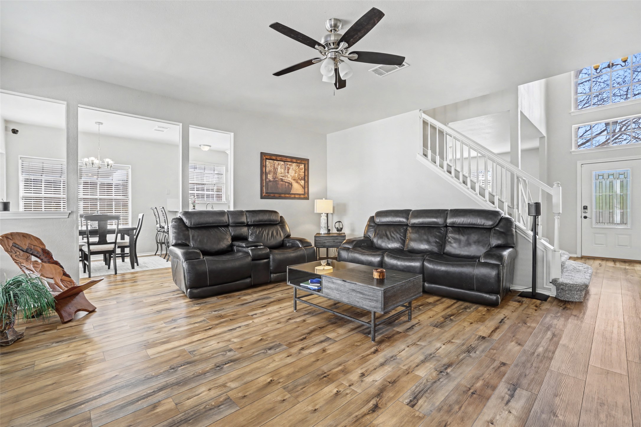 1109 Pebble Brook Road Cedar Park, TX 78613 - Photo 10 of 40 Living area featuring hardwood / wood-style flooring, plenty of natural light, and suspended lighting