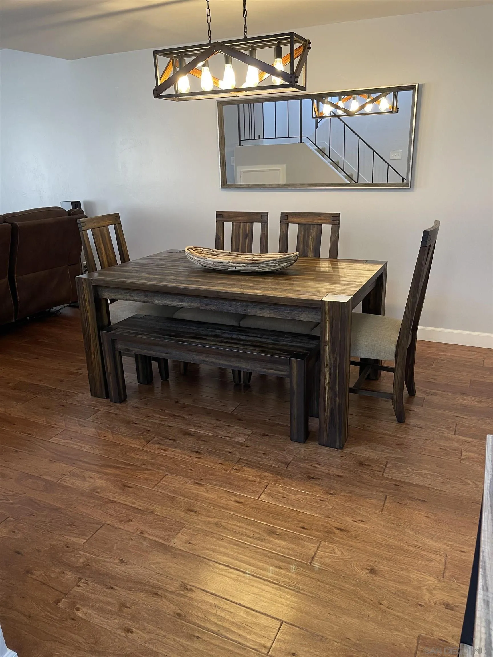10306 Leila Lane Santee, CA 92071 - Photo 11 of 31 a bedroom with furniture and a chandelier