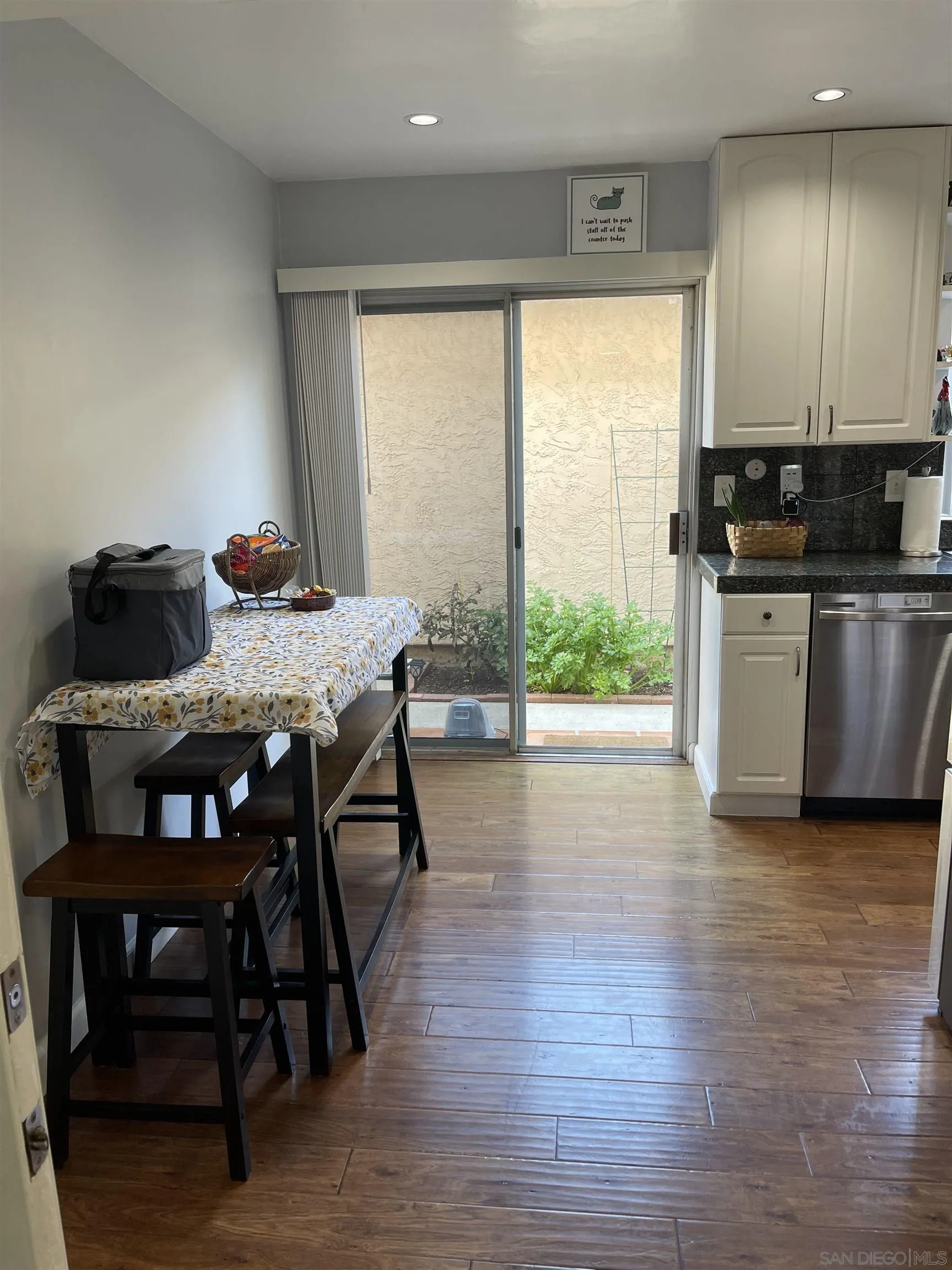 10306 Leila Lane Santee, CA 92071 - Photo 16 of 31 a view of a dining room with furniture window and wooden floor