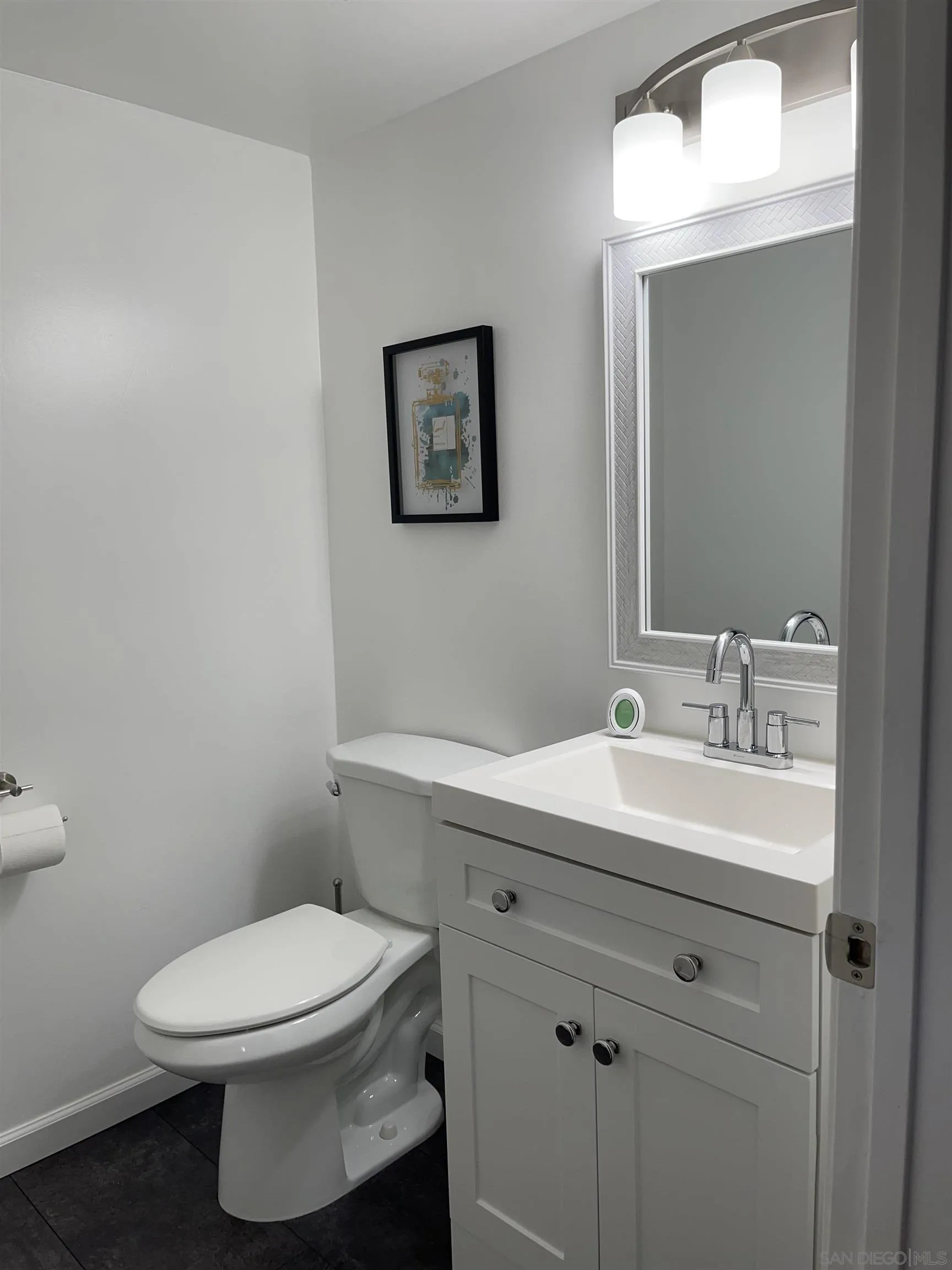 10306 Leila Lane Santee, CA 92071 - Photo 17 of 31 a bathroom with a toilet a sink and mirror