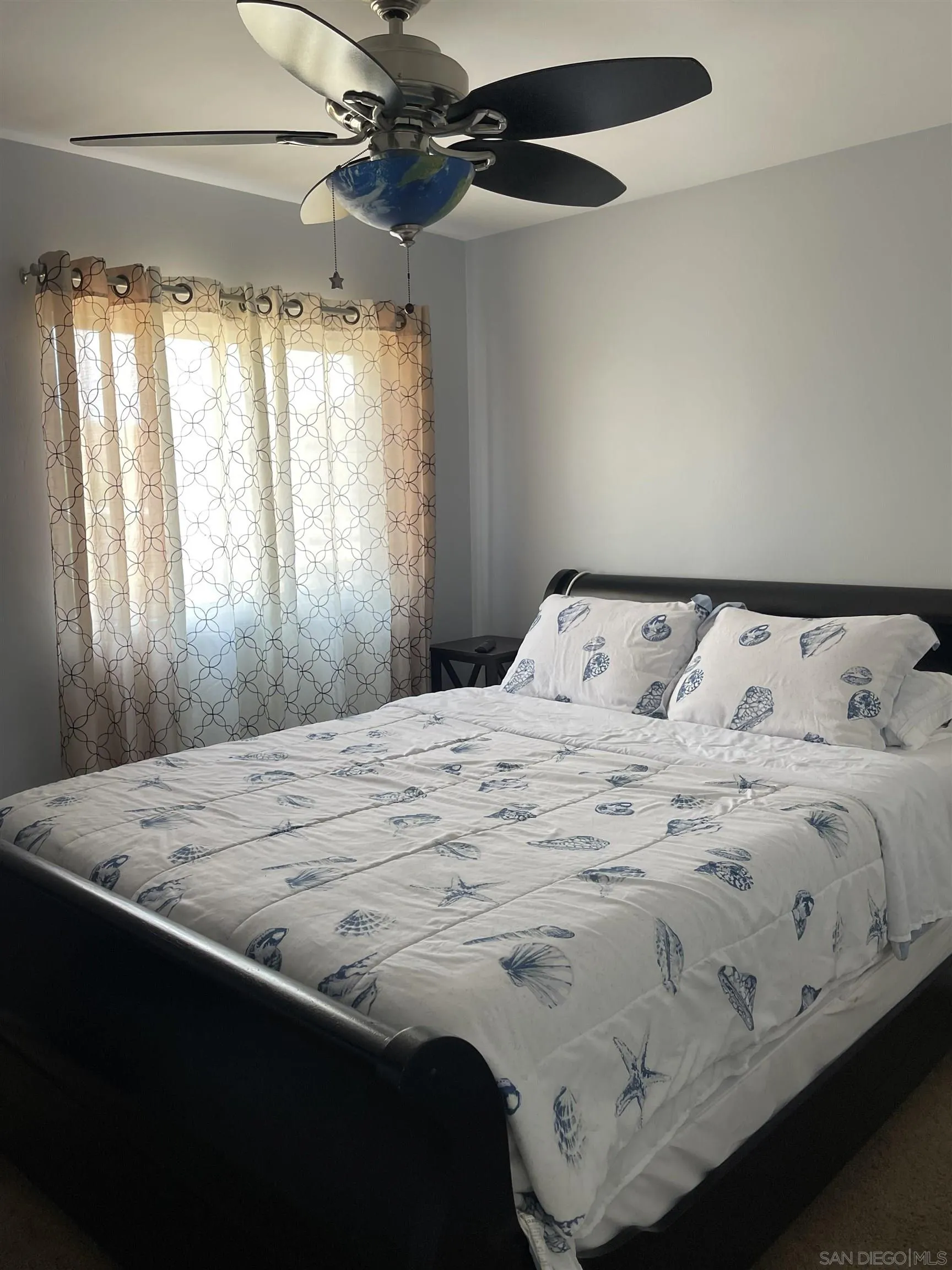 10306 Leila Lane Santee, CA 92071 - Photo 25 of 31 a bed sitting in a bedroom next to a window