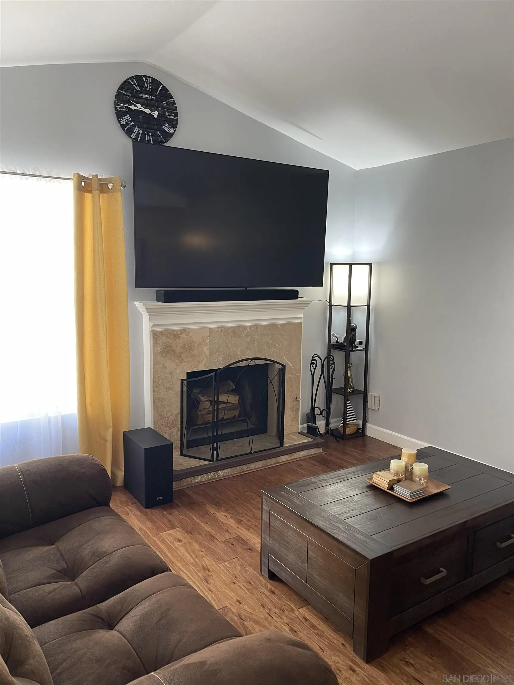 10306 Leila Lane Santee, CA 92071 - Photo 7 of 31 a living room with furniture and a fireplace