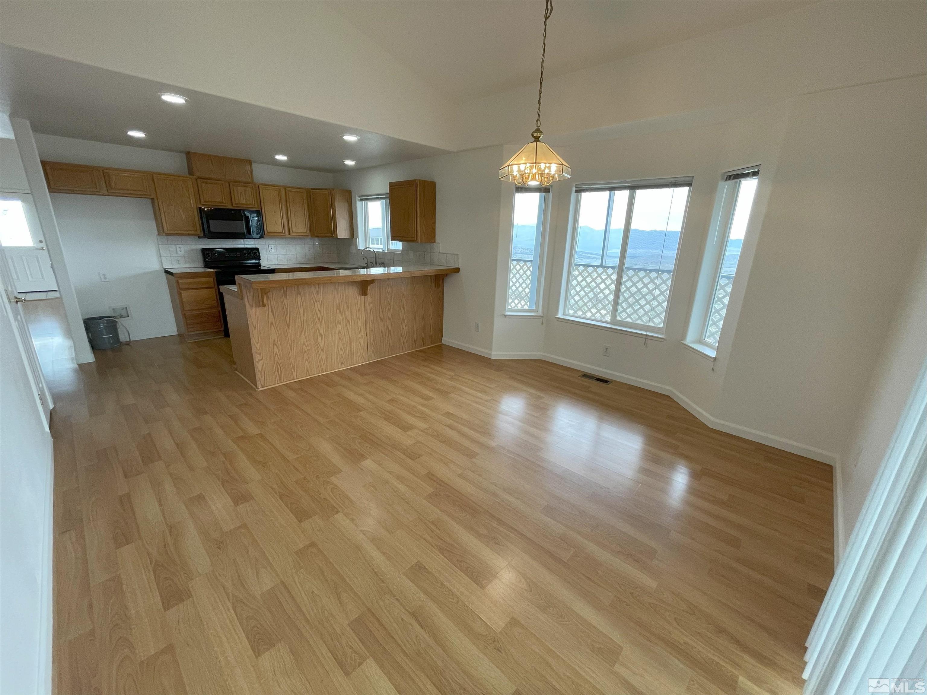 15064 North Red Rock Road Reno, NV 89508 - Photo 5 of 40 a view of a kitchen with furniture and a window