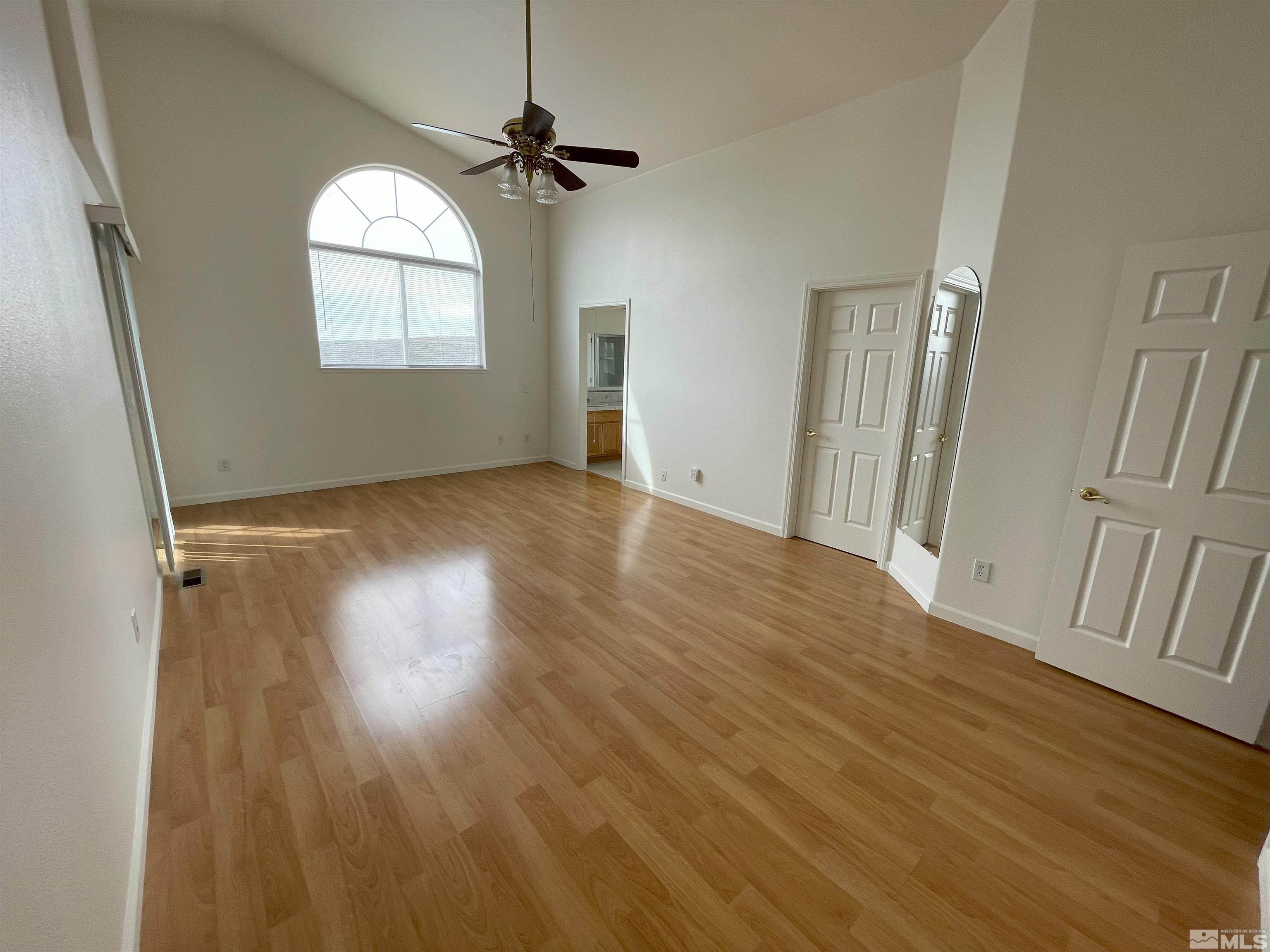15064 North Red Rock Road Reno, NV 89508 - Photo 6 of 40 wooden floor in an empty room with a window