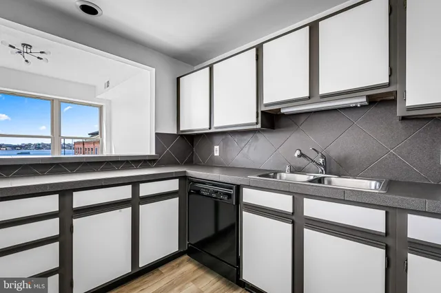 a bathroom with a sink toilet and a mirror