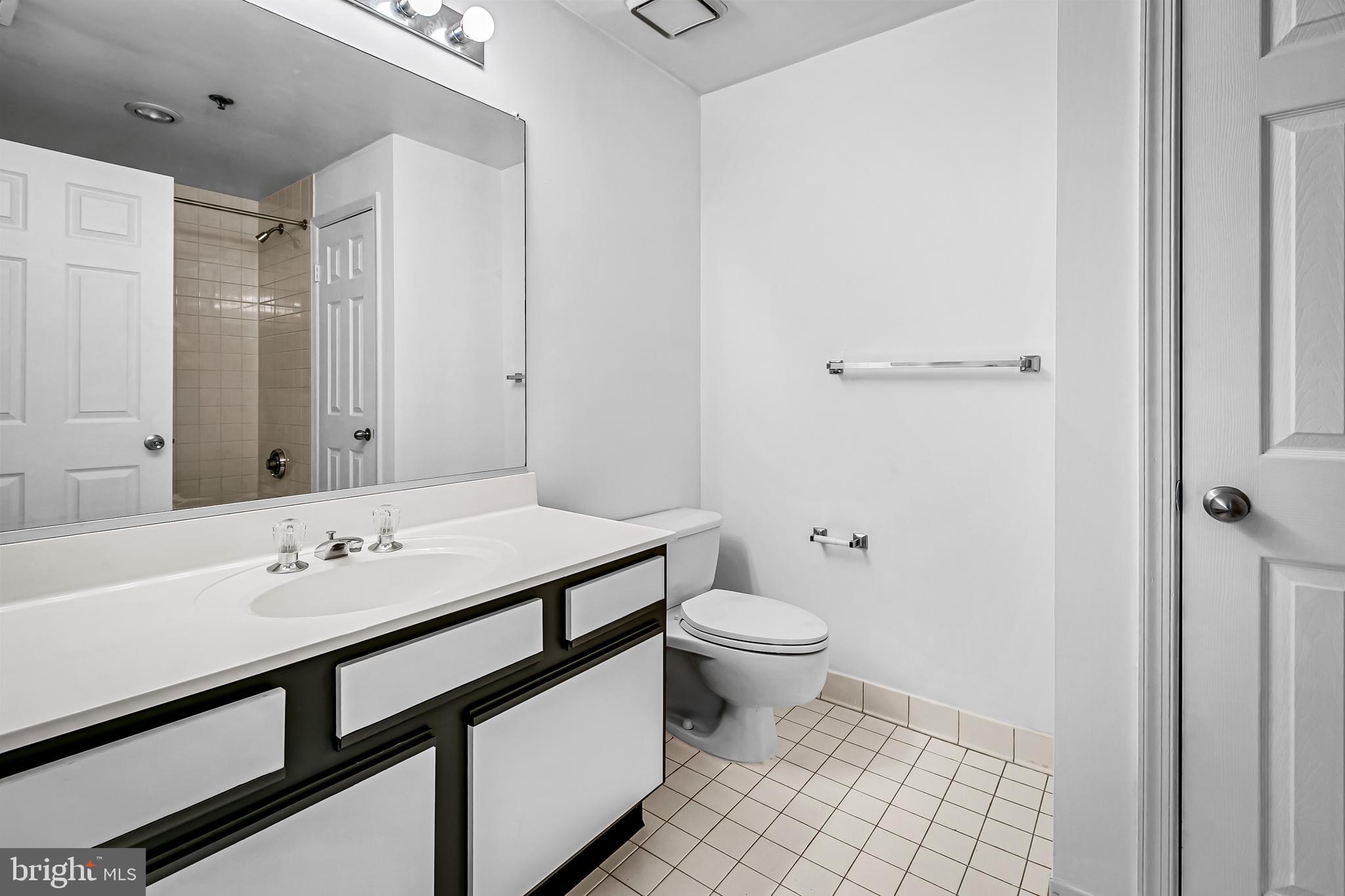 960 Fell Street, Unit 311 Baltimore, MD 21231 - Photo 18 of 59 a bathroom with a sink a toilet and shower