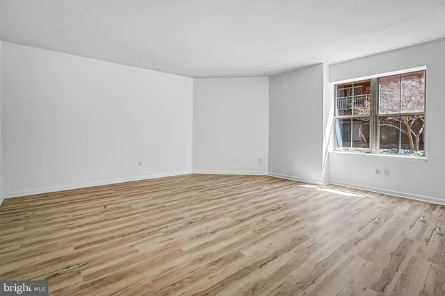 a spacious bathroom with a double vanity sink toilet and shower