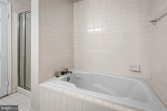 a front view of a building with a garden