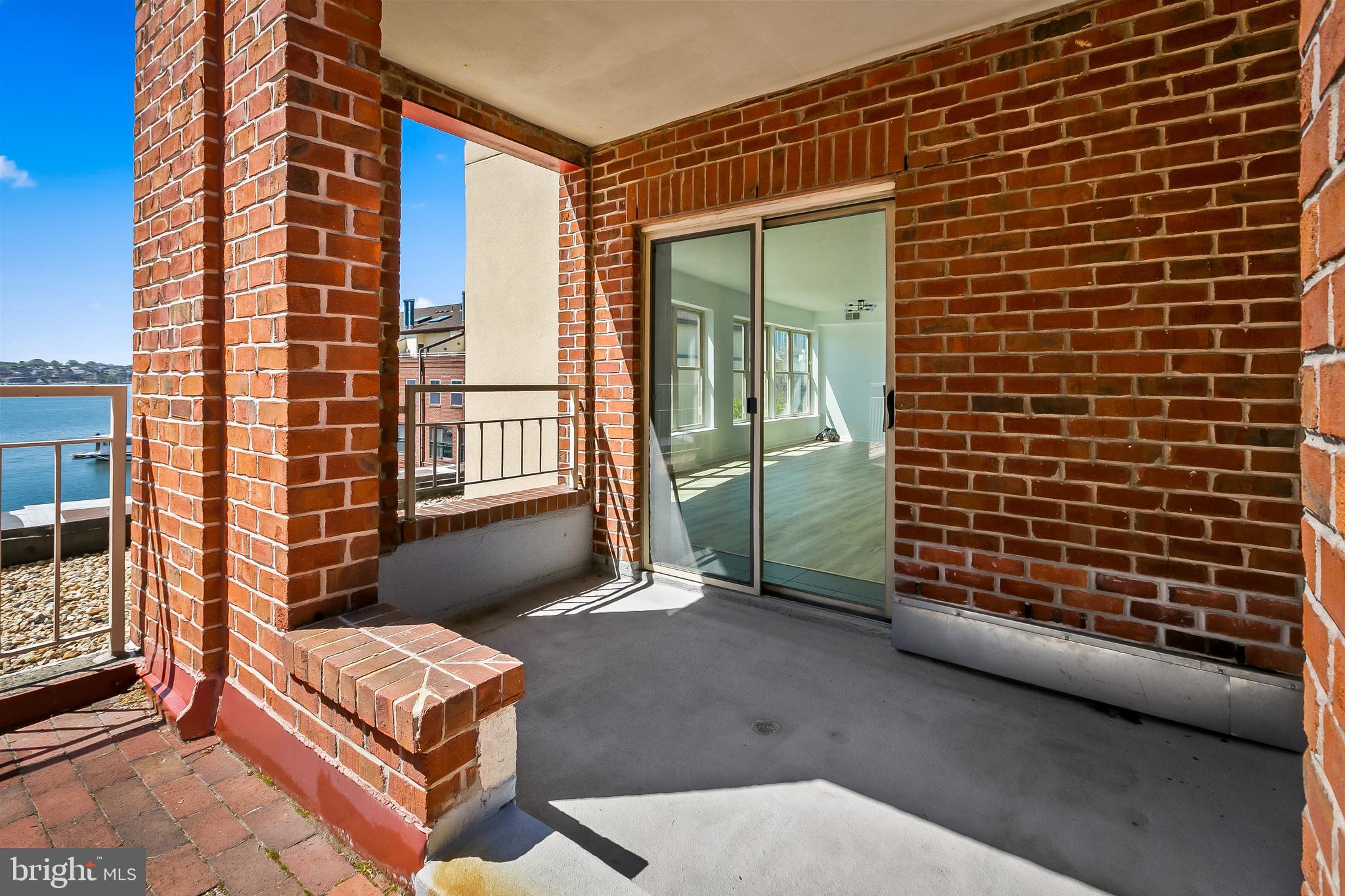 960 Fell Street, Unit 311 Baltimore, MD 21231 - Photo 30 of 59 a backyard of a house with outdoor seating