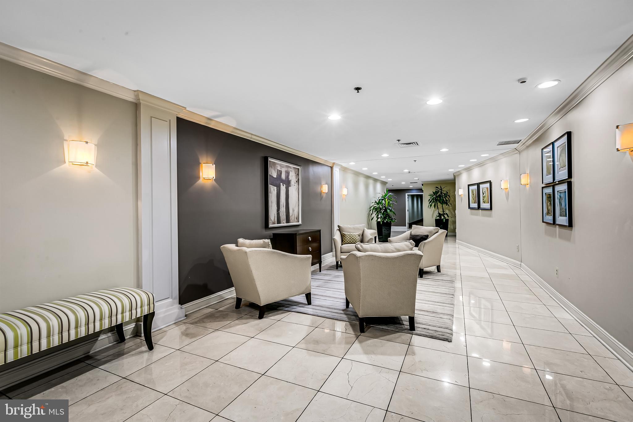960 Fell Street, Unit 311 Baltimore, MD 21231 - Photo 39 of 59 a living room with furniture and a window