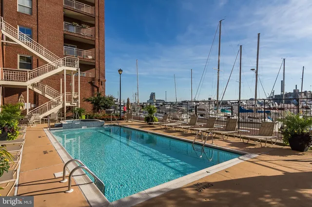 front view of a building with potted plants