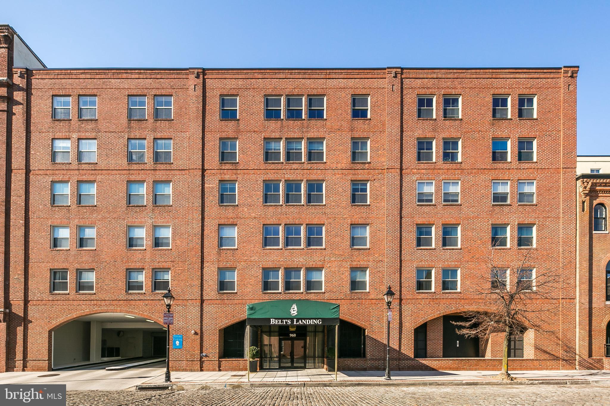 960 Fell Street, Unit 311 Baltimore, MD 21231 - Photo 51 of 59 a front view of a building with parking space