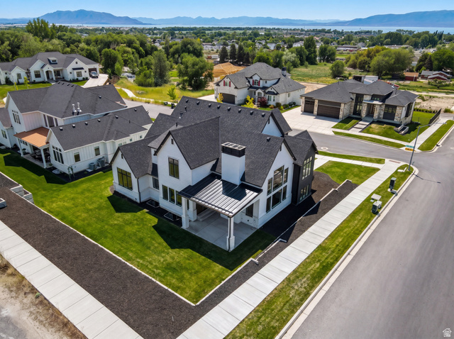 1682 North 1950 W Street, Unit 9 Provo, UT 84604 - Photo 69 of 84 Contemporary residence featuring a black asphalt shingle roof, white siding, and dark window frames