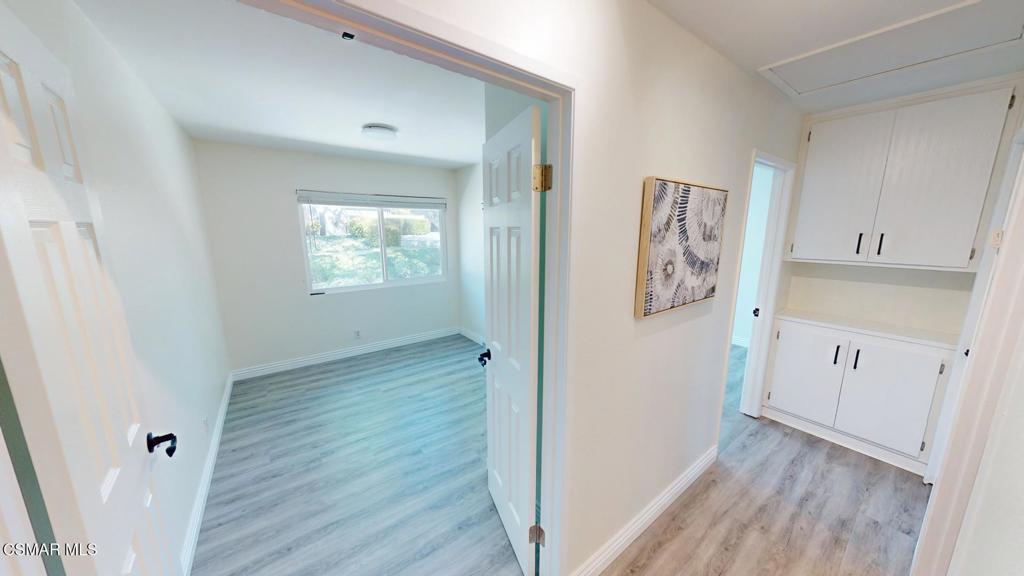 588 Rio Grande Circle Thousand Oaks, CA 91360 - Photo 15 of 30 a view of hallway with window and wooden floor