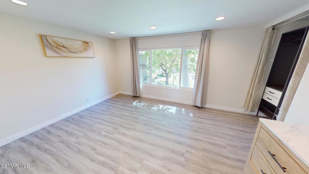 588 Rio Grande Circle Thousand Oaks, CA 91360 - Photo 23 of 30 a view of an empty room with wooden floor and a window