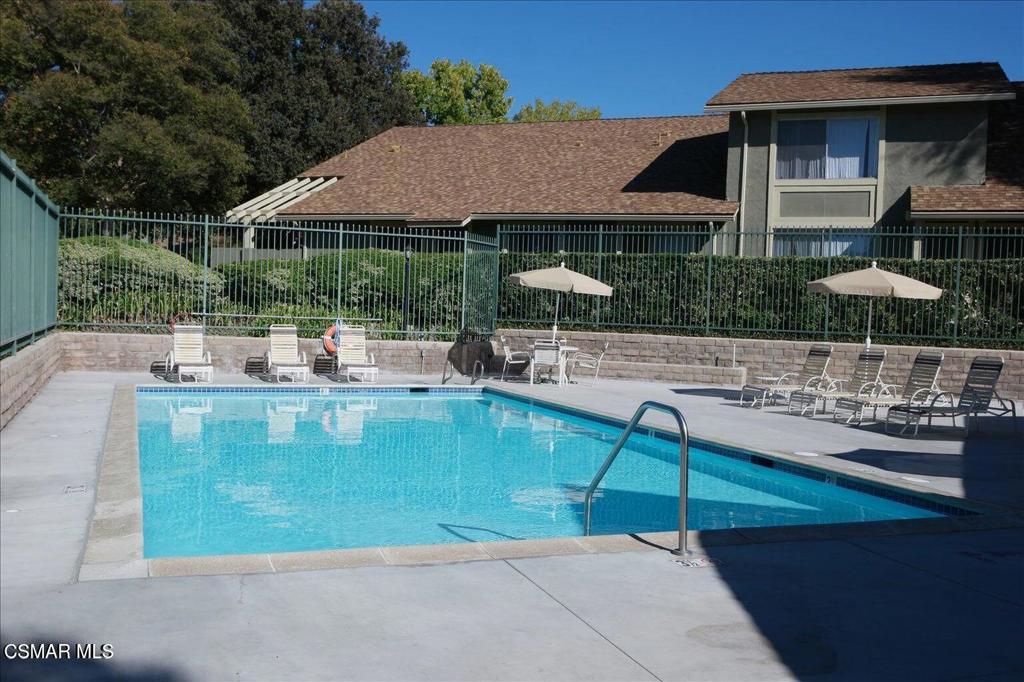 588 Rio Grande Circle Thousand Oaks, CA 91360 - Photo 28 of 30 a small pool with table and chairs under an umbrella