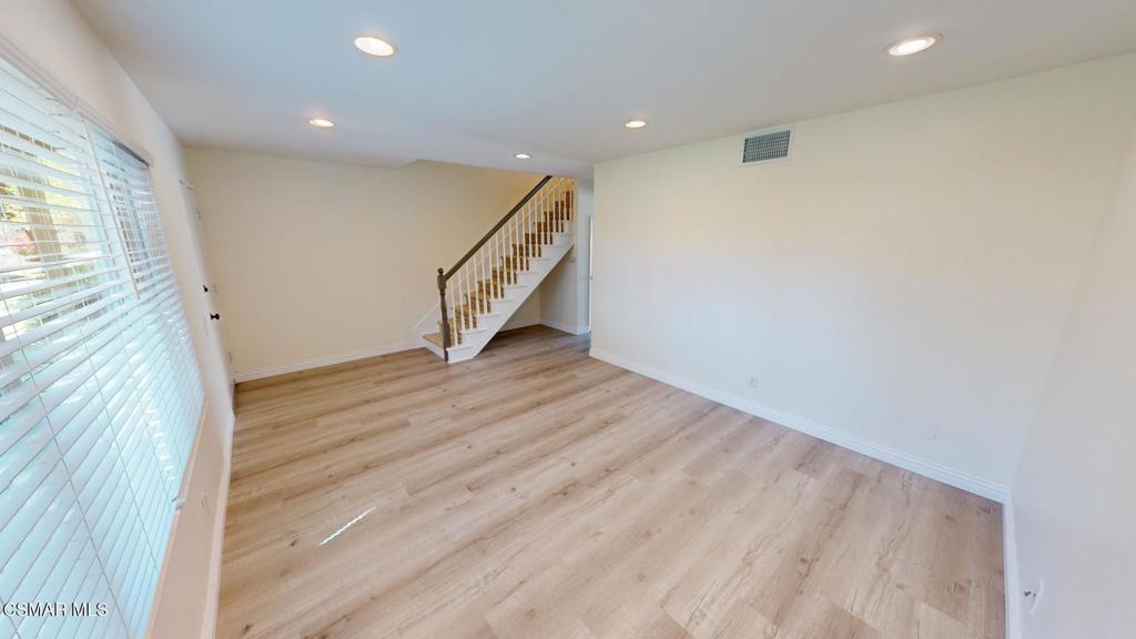 588 Rio Grande Circle Thousand Oaks, CA 91360 - Photo 5 of 30 a view of an empty room with wooden floor and a window