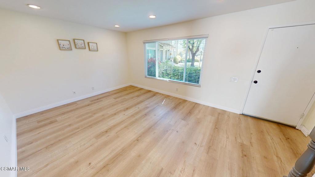 588 Rio Grande Circle Thousand Oaks, CA 91360 - Photo 7 of 30 an empty room with wooden floor and windows
