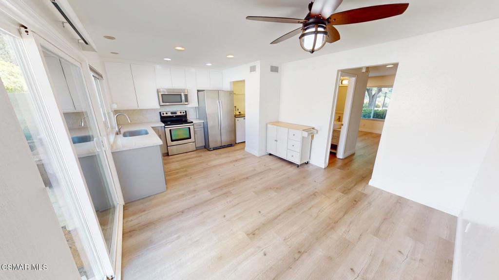 588 Rio Grande Circle Thousand Oaks, CA 91360 - Photo 10 of 30 a view of a kitchen with furniture and wooden floor