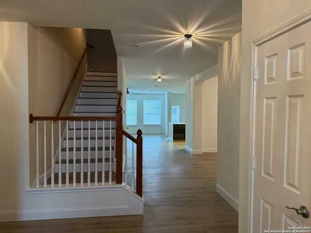 a view of entryway with wooden floor