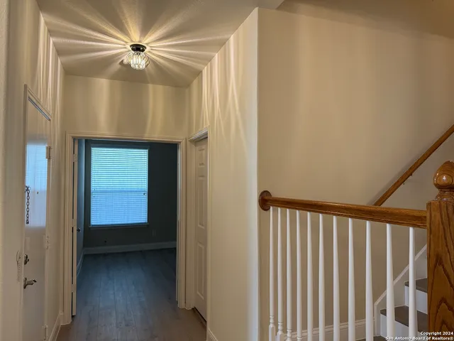 a view of a hallway with a white walls