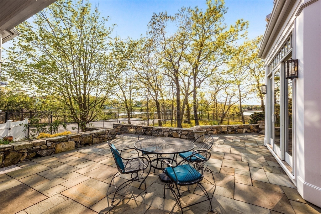 1 R Bailey's Island Road Scituate, MA 02066 - Photo 14 of 42 a backyard of a house with barbeque oven table and chairs