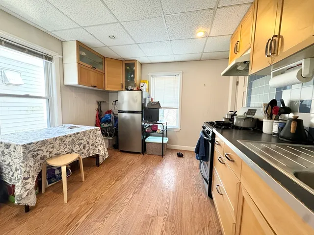 a bedroom with furniture and a wooden floor