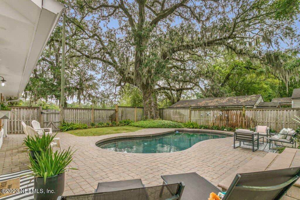 1623 Charon Road Jacksonville, FL 32205 - Photo 16 of 45 a view of a backyard with sitting area and furniture
