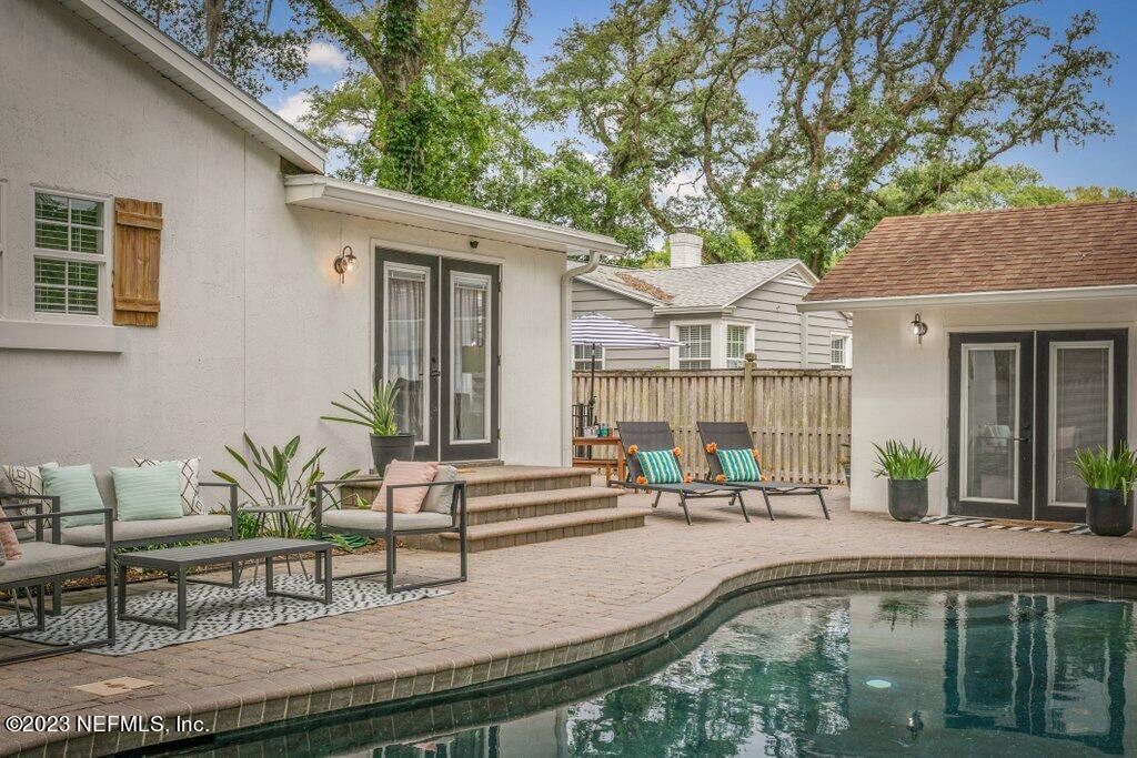 1623 Charon Road Jacksonville, FL 32205 - Photo 18 of 45 a swimming pool with outdoor seating and yard