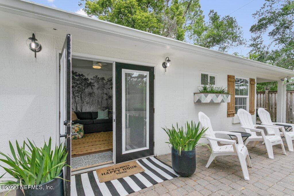 1623 Charon Road Jacksonville, FL 32205 - Photo 22 of 45 a view of a balcony with chairs and a potted plant