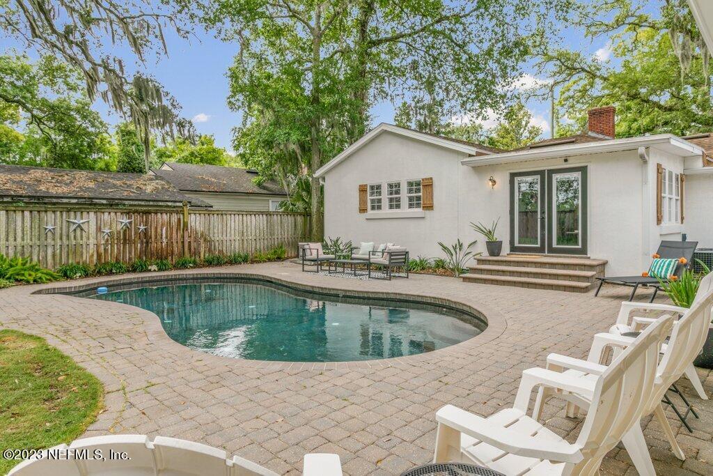 1623 Charon Road Jacksonville, FL 32205 - Photo 28 of 45 a view of a swimming pool with a patio