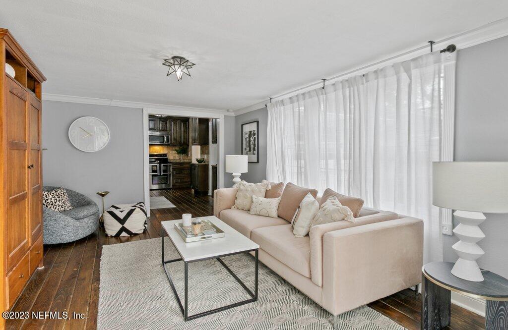 1623 Charon Road Jacksonville, FL 32205 - Photo 29 of 45 a living room with furniture and a fireplace