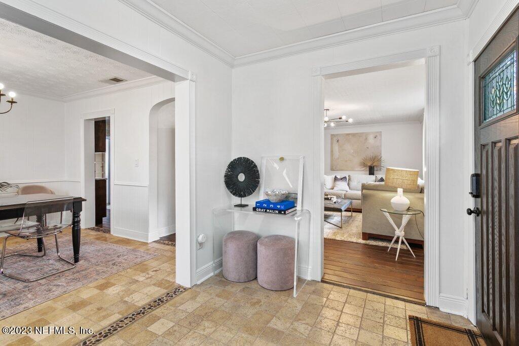 1623 Charon Road Jacksonville, FL 32205 - Photo 3 of 45 a living room with furniture a clock and a table