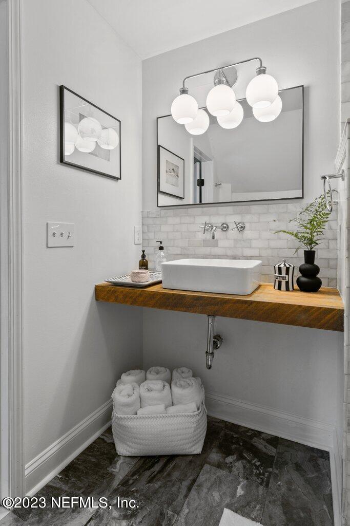 1623 Charon Road Jacksonville, FL 32205 - Photo 34 of 45 a bathroom with a sink mirror and toilet