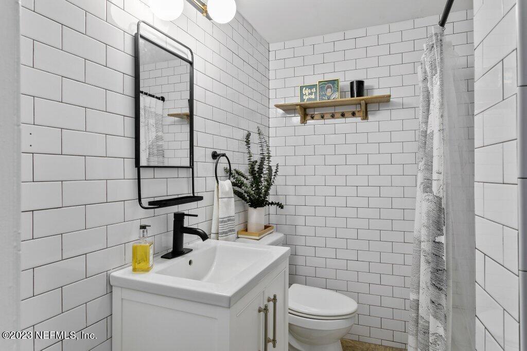 1623 Charon Road Jacksonville, FL 32205 - Photo 36 of 45 a bathroom with a sink toilet and shower