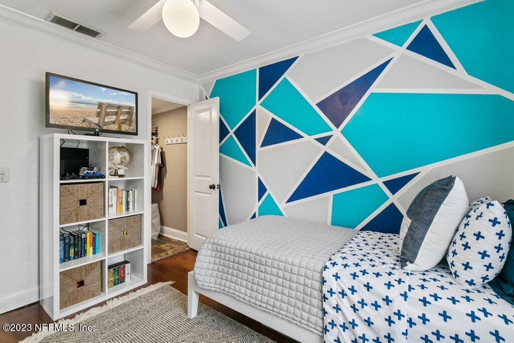 1623 Charon Road Jacksonville, FL 32205 - Photo 39 of 45 a bedroom with a bed and a closet