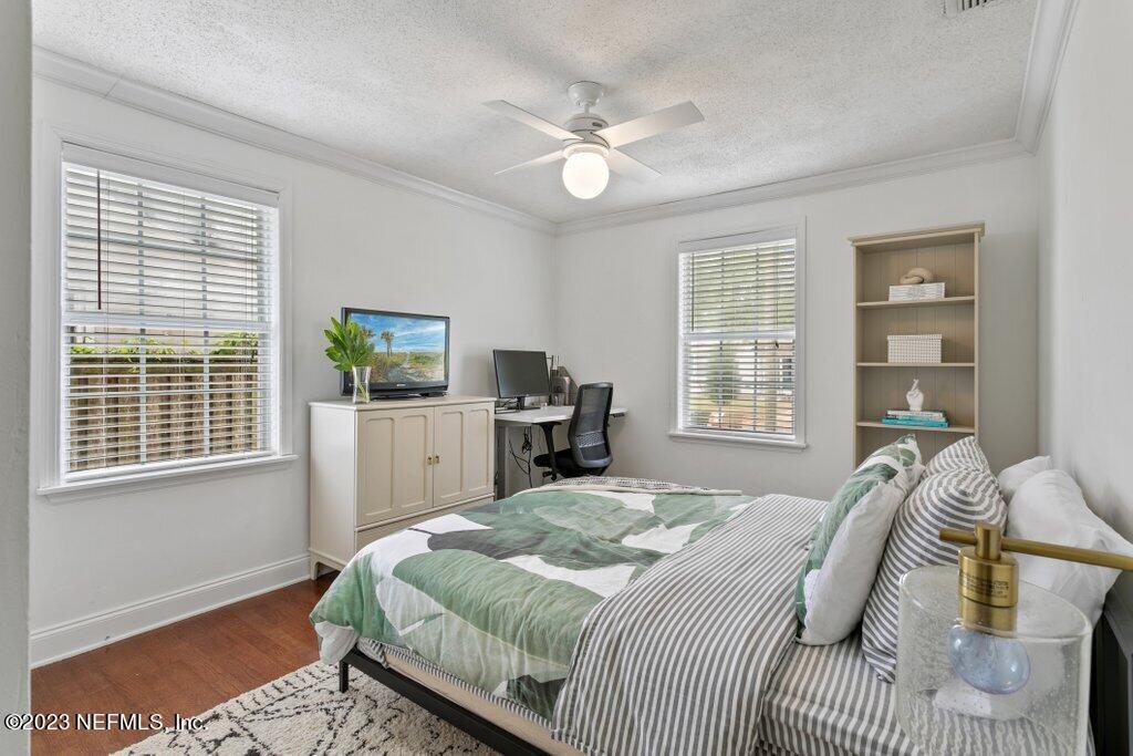 1623 Charon Road Jacksonville, FL 32205 - Photo 40 of 45 a bedroom with a large bed and a window
