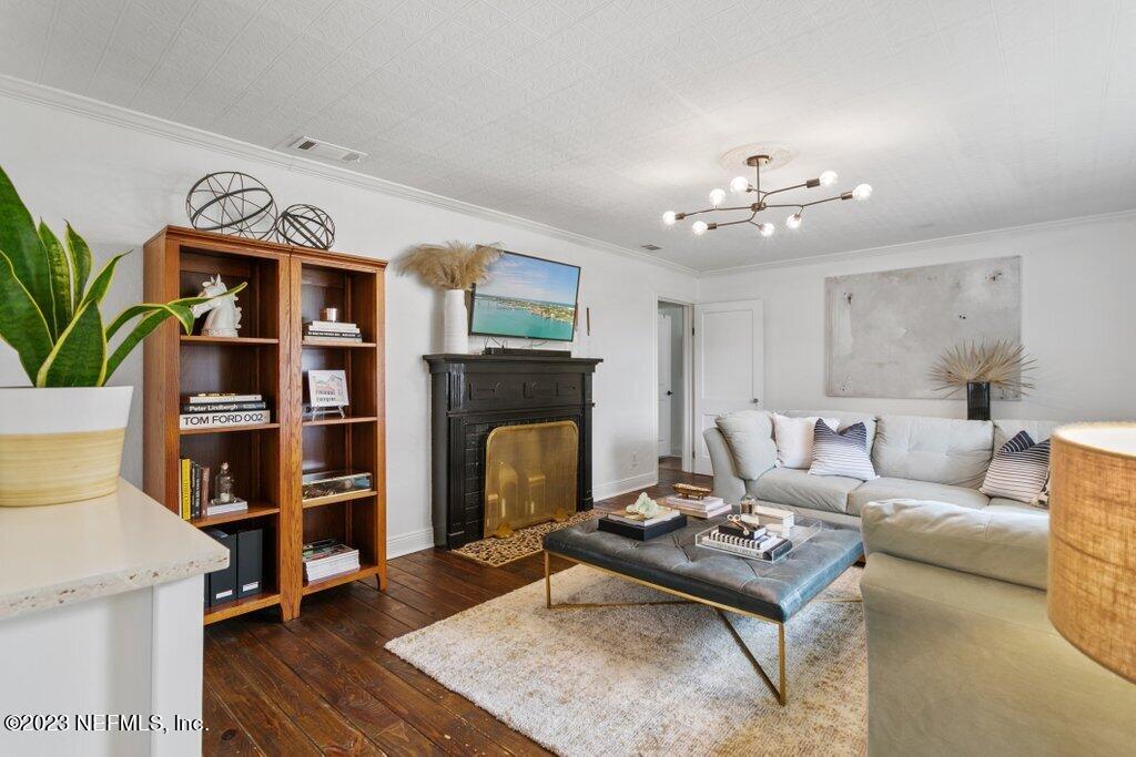 1623 Charon Road Jacksonville, FL 32205 - Photo 4 of 45 a living room with furniture and a fireplace