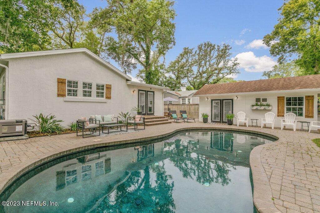 1623 Charon Road Jacksonville, FL 32205 - Photo 42 of 45 a white house with pool in front of it