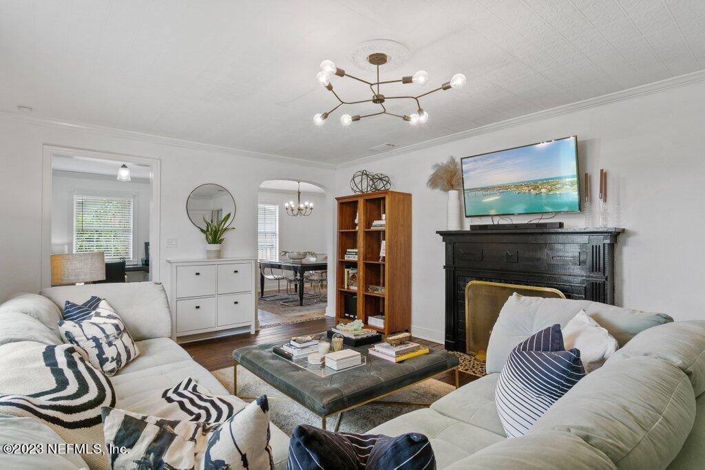 1623 Charon Road Jacksonville, FL 32205 - Photo 5 of 45 a living room with furniture and a fireplace