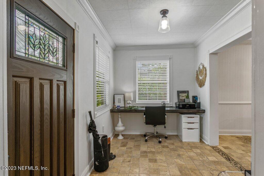 1623 Charon Road Jacksonville, FL 32205 - Photo 8 of 45 a view of a workspace with furniture and a window