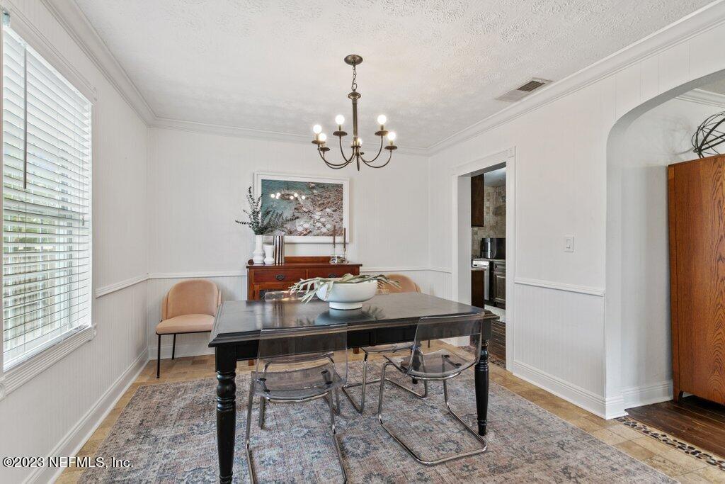 1623 Charon Road Jacksonville, FL 32205 - Photo 10 of 45 a view of a dining room with furniture window and wooden floor