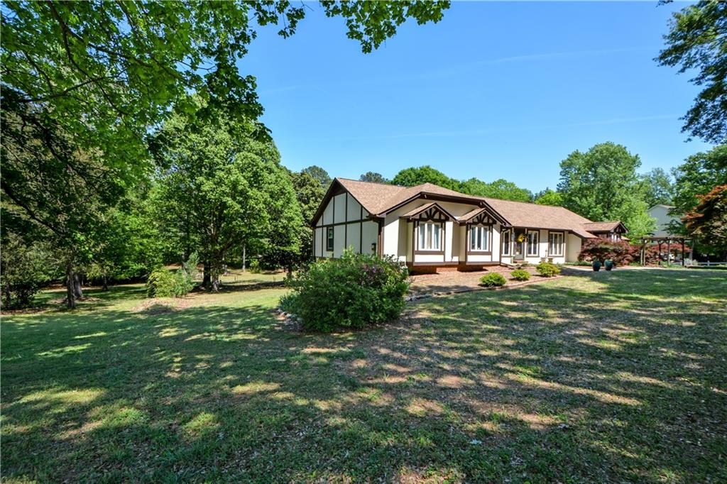 130 Hawn Road Fayetteville, GA 30215 - Photo 61 of 67 a front view of a house with a yard